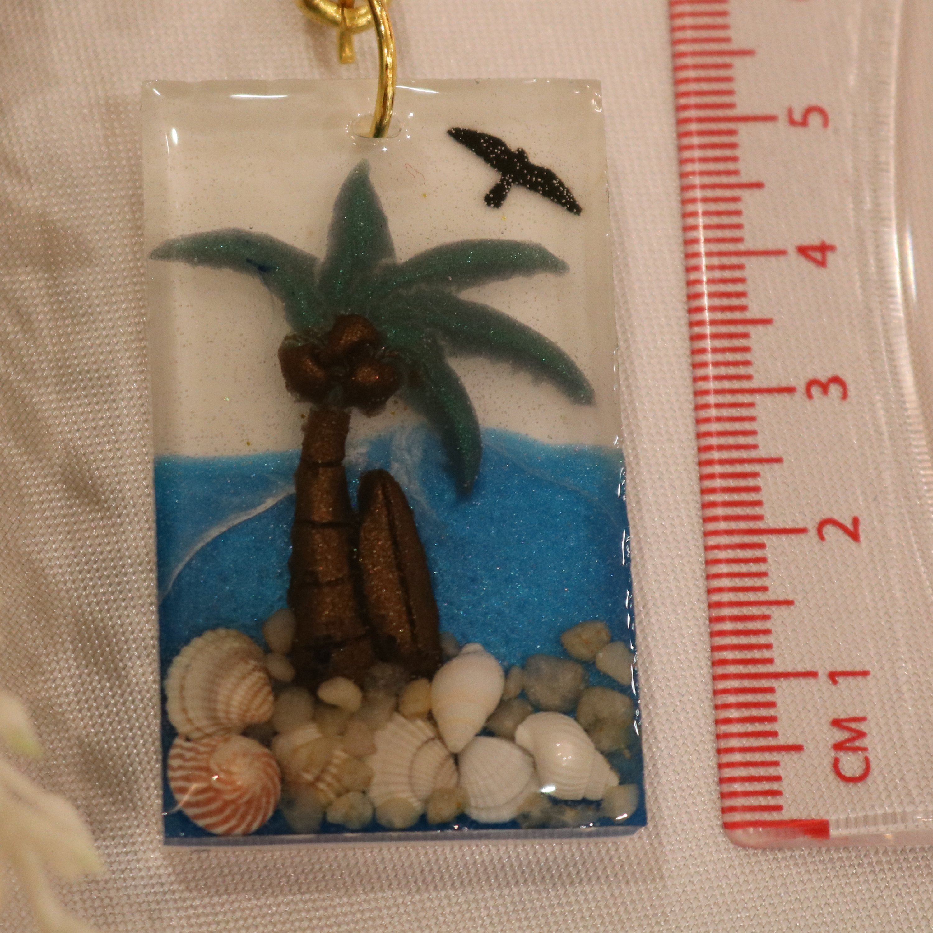 سرکلیدی  یا آویز ماشین رزینی سه بعدی طرح دریا با صدفهای طبیعی 