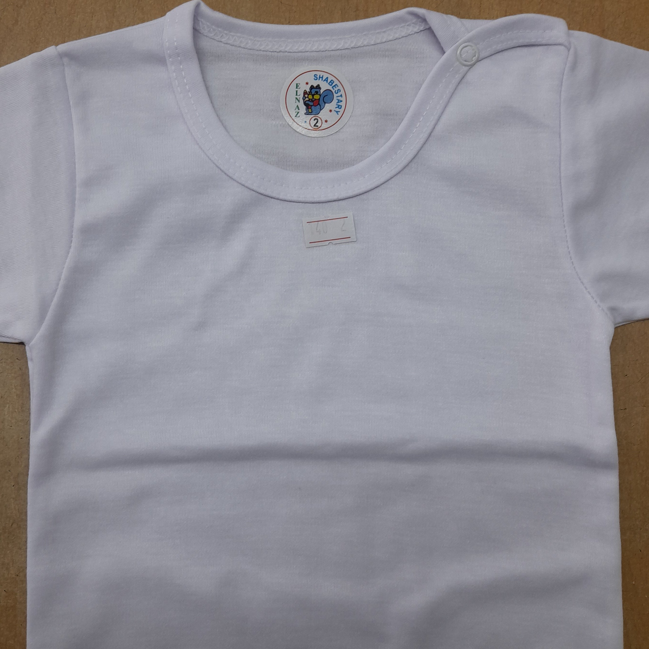 بلوزنوزادی سفیدرنگ ازجنس پلی استرپنبه در8سایز