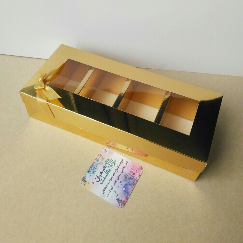 جعبه گز و شکلات طلایی  لبه دوبل 4خانه ابعاد مفید 20 در 7 با ارتفاع 5 سانت با پاپیون طلایی 