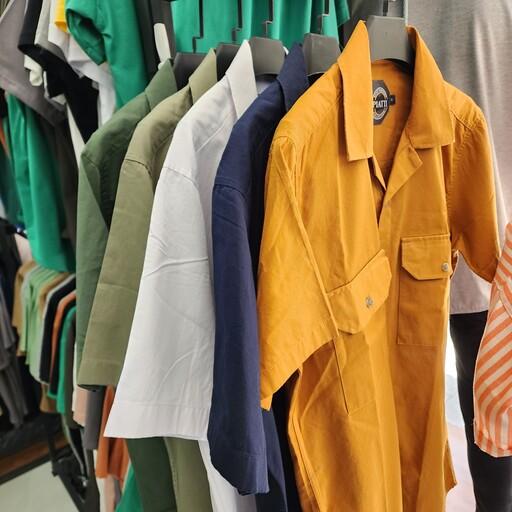 پیراهن مردانه استین کوتاه جنس کتان یقه انگلیسی در رنگبندی و سایز بندی مدیوم تا دو ایکس لارج