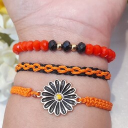 دستبند ست دوتایی و سه تایی(دست ساز) ترکیبی از رنگ نارنجی و مشکی دستبندی دلربا و خاص