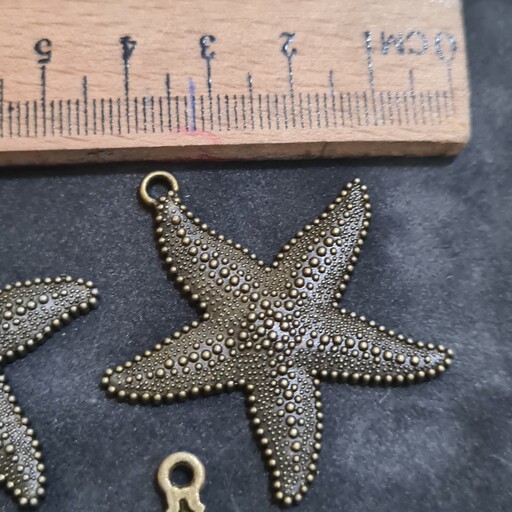 خرجکار کشکول مدال    (طرح ستاره دریایی ) برجسته حلقه دار  بزرگ  برنزی جنس محکم ومرغوب 