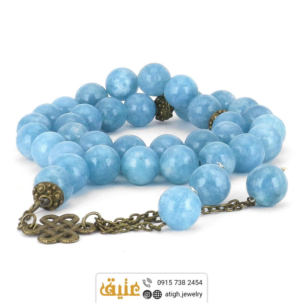 تسبیح آکوامارین طبیعی لوکس و کمیاب 33 دانه دستساز‌ تراش لانه زنبوری طراحی اسلیمی