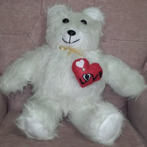عروسک خرس بزرگ پرز بلند به همراه قلب قرمز روی سینه
