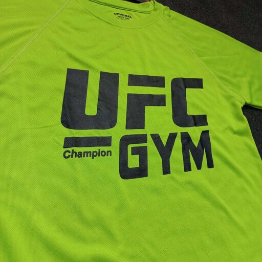 تیشرت ورزشی سوزنی UFC رنگ فسفری 