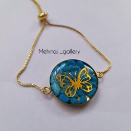 دستبند رزینی فیروزه ای طرح پروانه باقاب و زنجیر طلایی