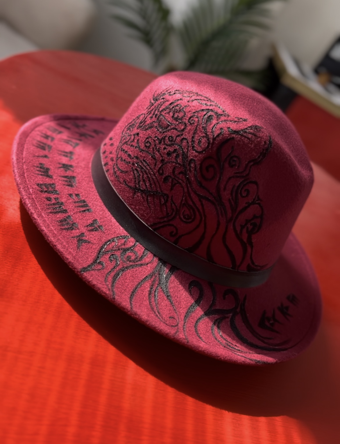 Hand-painted hat featuring an Iranian Cheetah design and Cuneiform calligraphy